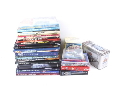 A large assortment of Doctor Who collectables. Including the first book from the 1960s, a boxed Dalek, DVDs, etc.