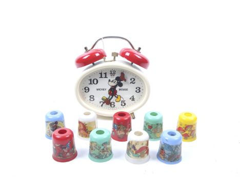 An assortment of 1940s Disney paraphernalia. Comprising a set of nine Christmas tree light shades, each having images from va