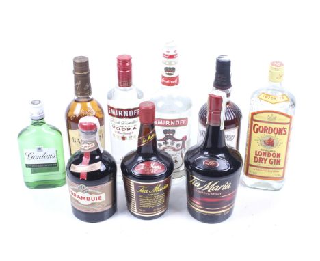 Nine bottles of mixed alcohol. Including a bottle of Bacardi rum, 70cl, 40% vol, a bottle of Smirnoff vodka, 70cl 37.5%, a bo