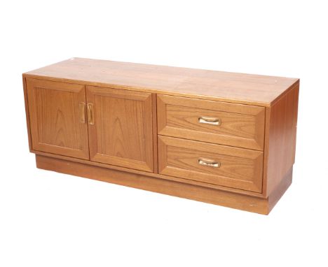 A low teak G Plan sideboard. With two drawers and double doors, with gold on red G Plan label. H53cm x W131cm x D54cm.
