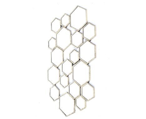 A vintage wall mirror. Constructed of multiple hexagonal mirrors with brass rims, all combined to create a collage effect, ov
