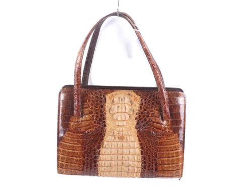 A vintage brown crocodile skin handbag and purse. The handbag with two handles, studs to the underside and a clip lock clasp.