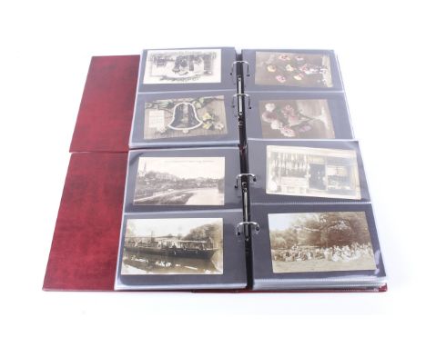 Two albums of assorted vintage postcards. Including christmas examples, comical scenes, animals, portraits of women, etc. 