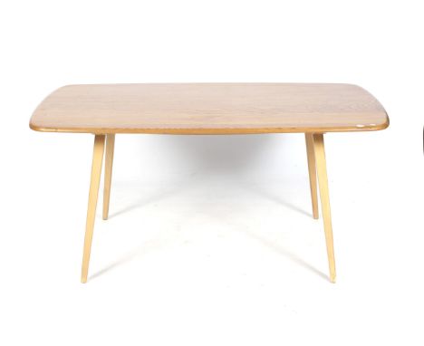 A mid-century Ercol (blue label) elm dining table. With curved edges, raised on tapered supports, H104cm x W153cm x D76.5cm C
