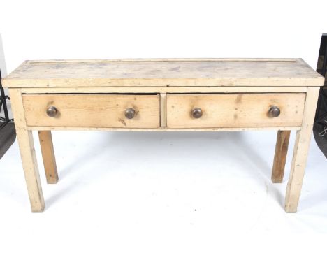 A rustic vintage scrubbed pine sideboard. With two drawers and turned handles on square supports. L184cm x D45cm x  H94cm