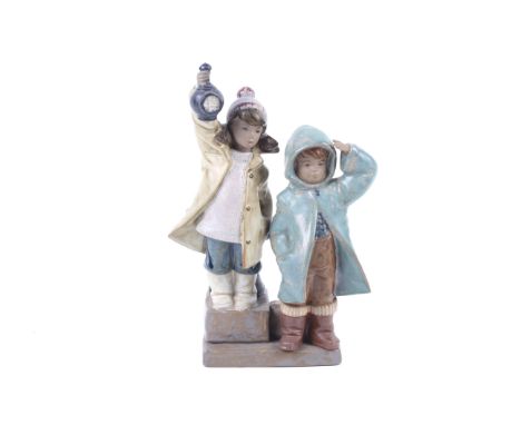 A circa 1980s Lladro Daisa group ceramic figurine. Boy and a girl waiting onthe harbour side with a lantern, #2178. H26cm