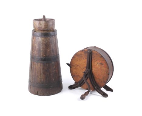 A vintage York knife cleaner sharpener and butter churn. The hand turning oak sharpener on a cast metal stand, with the origi