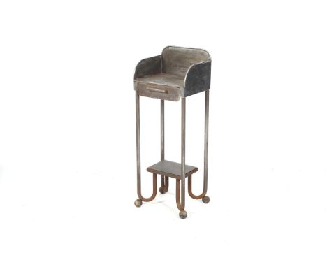 A vintage metal industrial medical stand. With a high gallery and sides, the drawer opening to reveal three compartments, rai