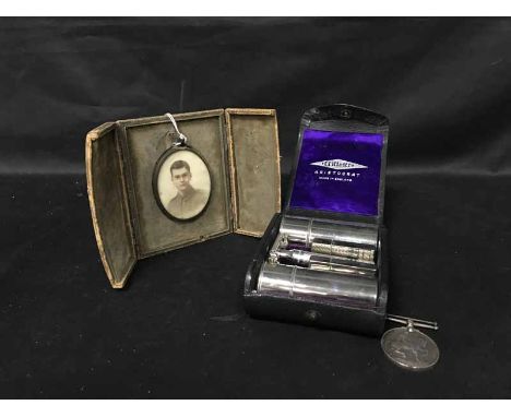 MINIATURE HEAD AND SHOULDERS PORTRAIT OF A WWI SOLDIER along with a WWI Defence Medal,  two sewing kits, three razors and spe