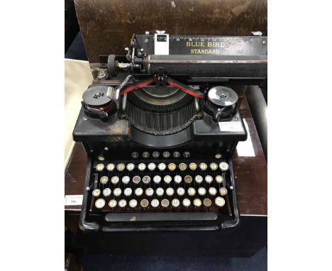 BLUE BIRD TYPEWRITER along with a Singer sewing machine