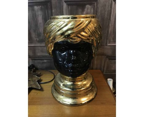 BLACK AND GOLD CERAMIC FIGUREof a boys head, with contemporary table lamp