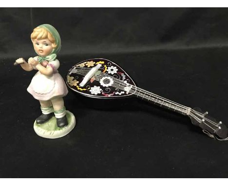 LOT OF CERAMICSincluding Hummel style figures, a miniature musical Mandolin and a Maruri example