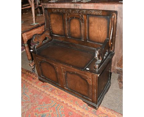 A Carved Oak Monks Bench, 20th century, 95cm by 42cm by 96cm (open)