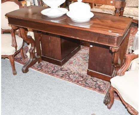 A Gothic Style Mahogany Console Table, raised on reeded scroll supports, 137cm by 48cm by 88cm 