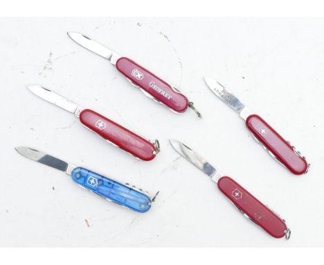Five Swiss Army multi-tool penknives 