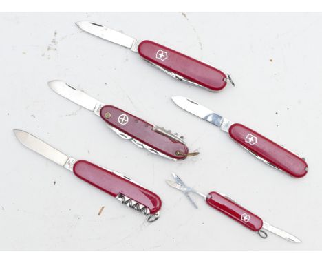 Five Swiss Army multi-tool penknives, one in pouch 