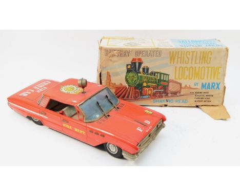 A 1960s Marx Toys battery operated 'Whistling Locomotive' together with a 1950s tinplate Buick 'Fire Chief' patrol car, motor