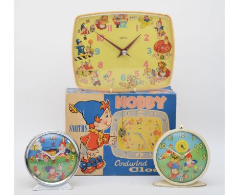 A 20th century Smiths painted tin plate novelty Noddy and Big Ears alarm clock with a boxed Smiths cord wind Bakelite novelty