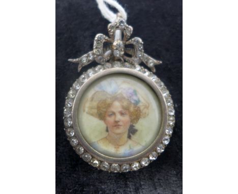 A Continental antique silver and white crystal mounted pendant, set with a circular hand-painted study of a woman's portrait 