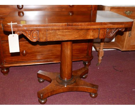 A William IV rosewood card table, with baise top, raised on x-shaped base with bun feet and castors 