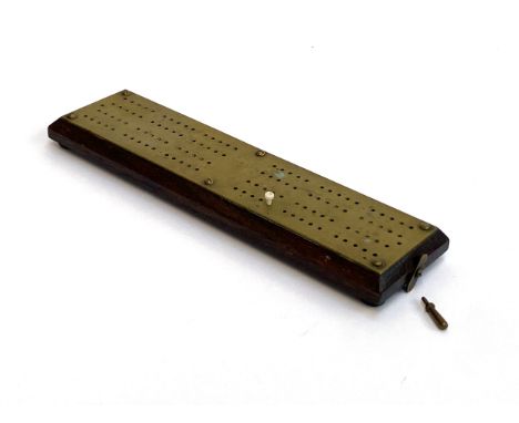 A brass and oak cribbage board, 29.5cmL