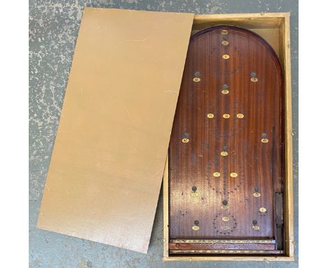 A vintage mahogany bagatelle board in fitted case, 76cmL