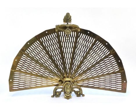 A brass fan fold pierced fire screen, 60cmH