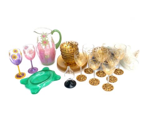 A mixed lot of quirky glass to include a pink and green carafe, leopard print goblets, bowls, plates, etc