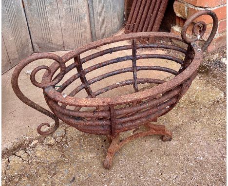 A wrought iron oval fire grate, 67cmW