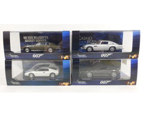 Four MINICHAMPS 1:43 Scale cars from the James Bond collection including a LOTUS ESPRIT S1 , an ASTON MARTIN DB5 in silver  ,