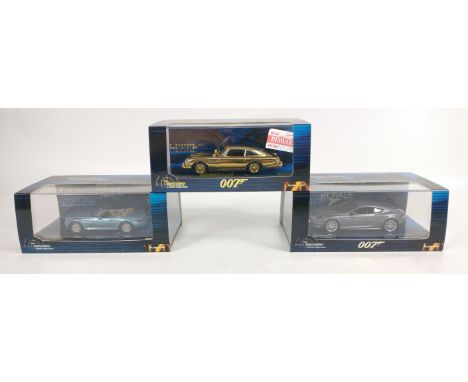 Three MINICHAMPS 1:43 scale models from the James Bond collection to include a limited edition number 0025 of 2016 GOLD ASTON