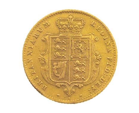 An 1863 Victoria young head shield London Half Sovereign 22 carat yellow gold, this coin is scratched (over the Queens face) 