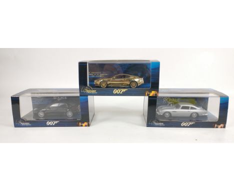 Three MINICHAMPS 1:43 scale models from the James Bond collection to include a limited edition number 1490 of 2016 GOLD ASTON