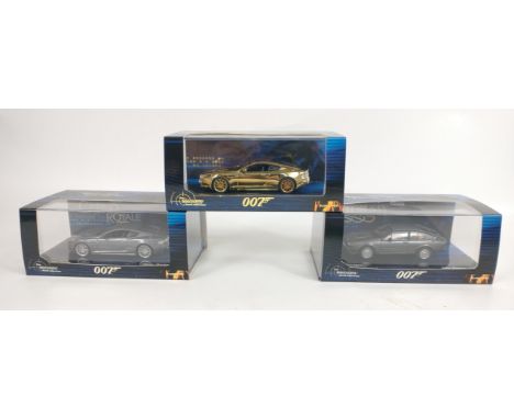 Three MINICHAMPS 1:43 scale models from the James Bond collection to include a limited edition number 0148 of 2016 GOLD ASTON