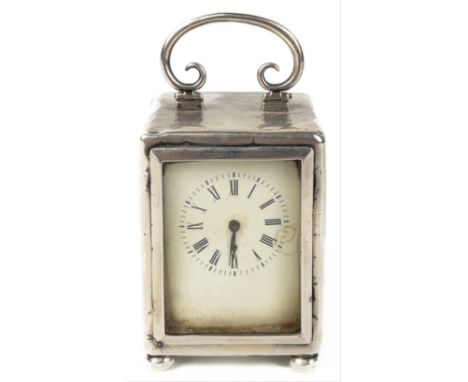 A miniature boudoir French movement solid silver carriage clock. Hallmarked London 1898 Makers Mark WO. Stands 9cm high appro