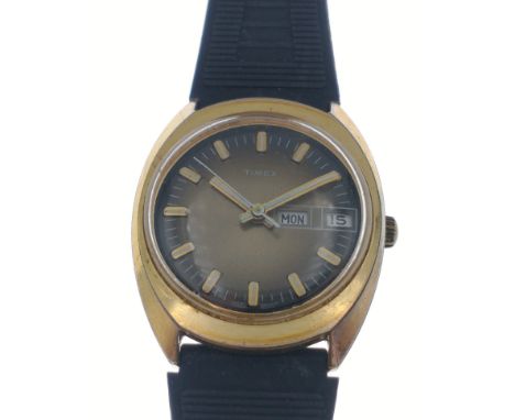 A nice clean TIMEX day and date just yellow metal cased and stainless steel backed wristwatch ticking away quite happily on v