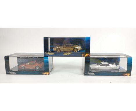 Three MINICHAMPS 1:43 scale models from the James Bond collection to include a Limited Edition number 58 of 2016 GOLD ASTON M