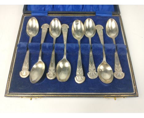 A set of eight RIFLE CLUB silver teaspoons all within a jewellers presentation case weight 112g approx, inscribed with 'Mlanj