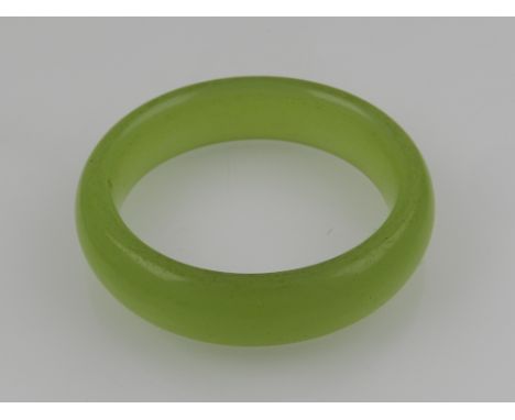 A green nephrite bangle.