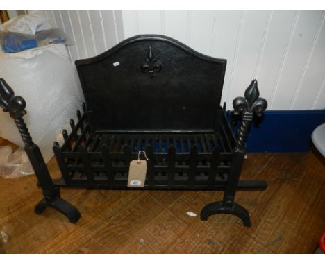 A cast iron fire grate, decorated with fleur-de-lis to back  H.61, W.90cm