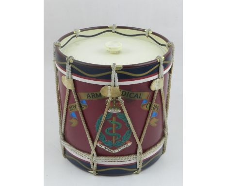 A regimental ice bucket, fashioned as a drum, printed with banner of Royal Army Medical Corps above coat of arms. H.17cm