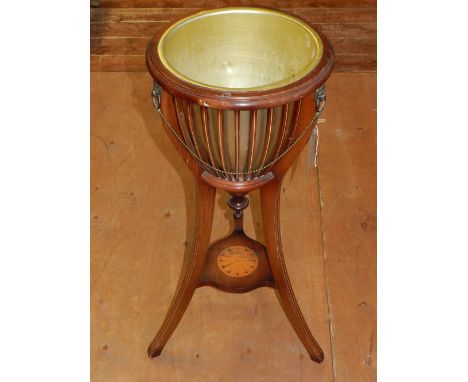 An Edwardian mahogany jardiniere stand, raised on tripod legs. 