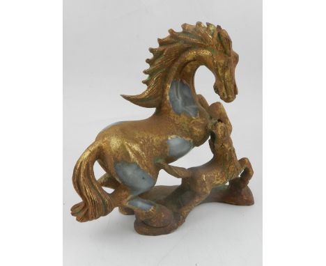 A carved hardstone model of horse and foal, extensively gilded, H,. 22cm.