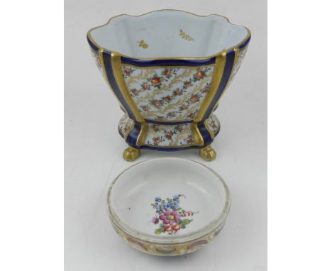 A Meissen porcelain trinket bowl (missing cover), painted with flowers within gilt scrolling foliage, bears crossed swords ma