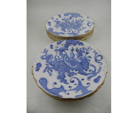 A quantity of Royal Worcester blue and white dinner plates, decorated with dragons amongst stylised clouds, bears factory mar