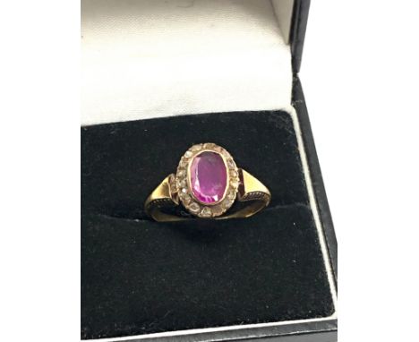 Fine Antique 18ct ruby &amp; rose cut diamond ring centre stone meares approx 8mm by 5mm with a halo of rose cut diamonds wei