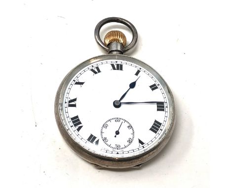 silver open face pocket watch  the watch is ticking 