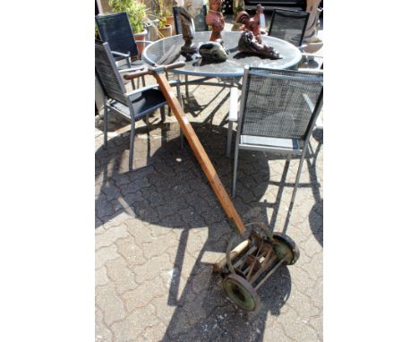 An old manual lawn mower