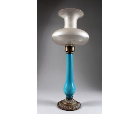 A blue opaque glass lamp with frosted shade