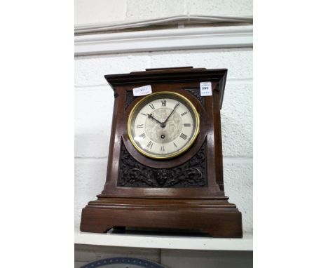 A mahogany mantel clock